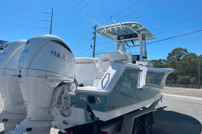 Slide: The Image of 2026 Sea Hunt Ultra 275 Coffin Box boat with dual Yamaha engines on a trailer. - 6