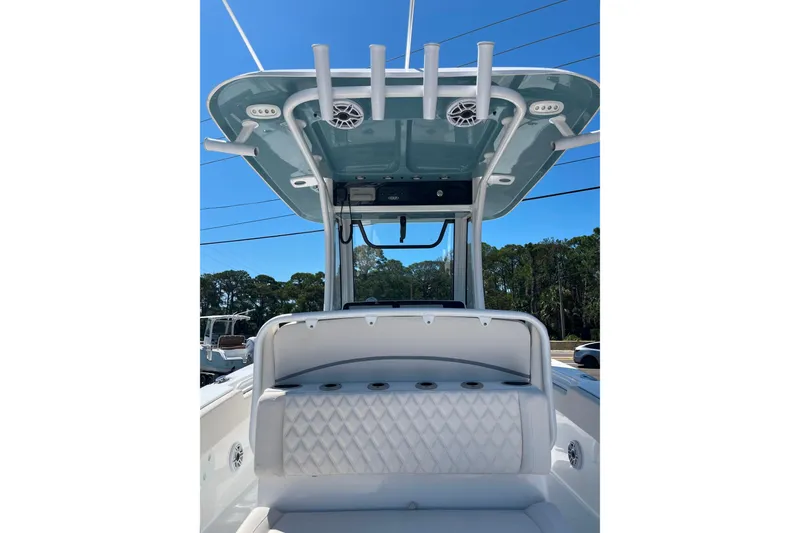 Slide: The Image of 2026 Sea Hunt Ultra 275 Coffin Box boat interior with seating and overhead speakers. - 7