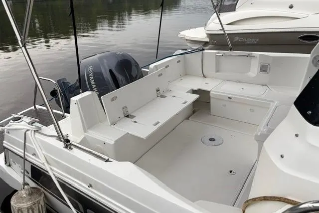 Slide: The Image of 2019 Jeanneau NC 795 boat with spacious deck and Yamaha outboard motor. - 2
