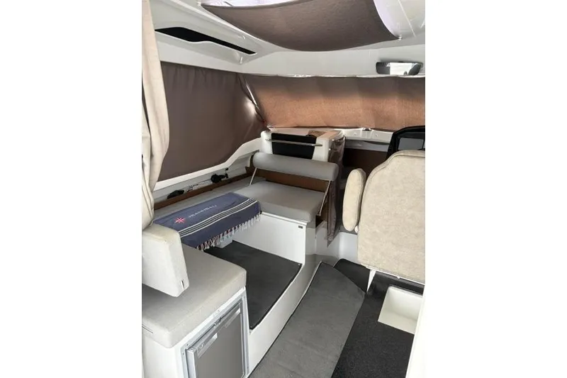 Slide: The Image of Interior of 2019 Jeanneau NC 795 boat, featuring seating and compact design. - 3
