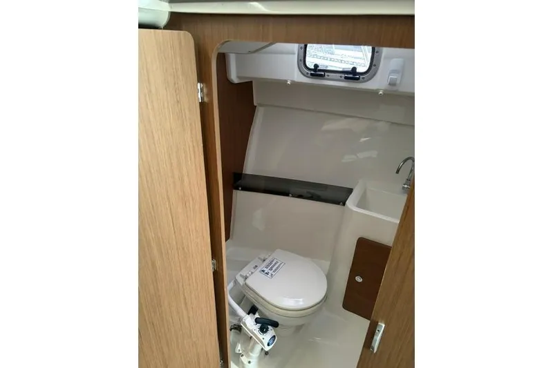 Slide: The Image of 2019 Jeanneau NC 795 boat bathroom interior with toilet and sink. - 8