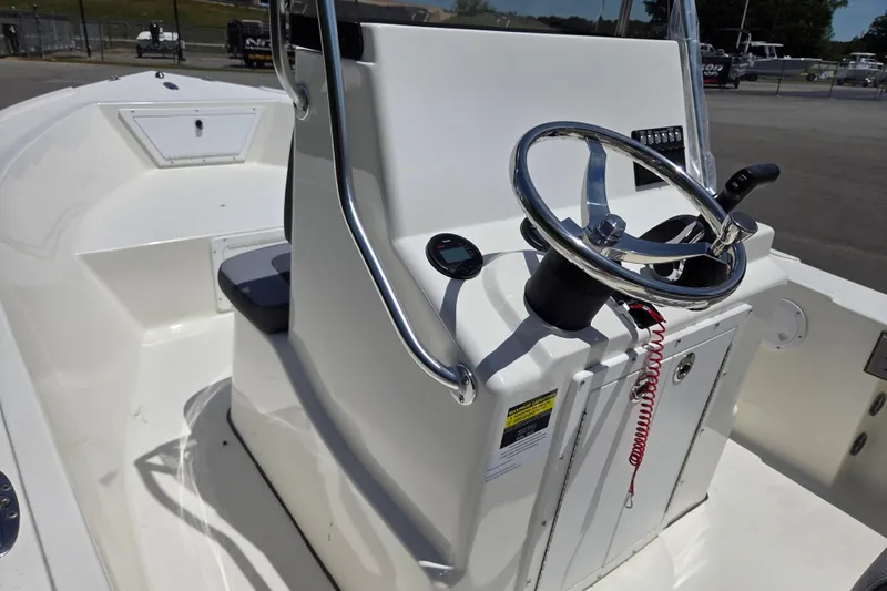 Slide: The Image of 2026 May-Craft 182 Center Console boat interior with steering wheel and control panel. - 10