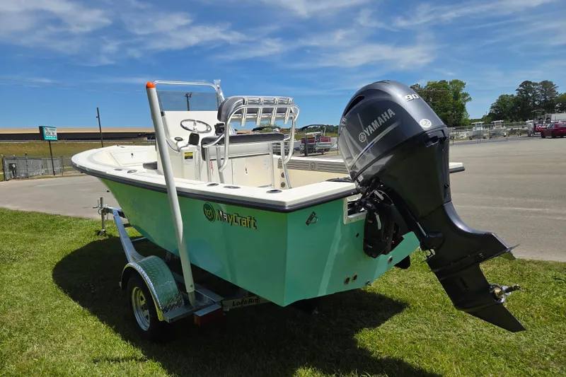 Slide: The Image of 2026 May-Craft 182 Center Console boat with Yamaha motor on trailer, parked outdoors. - 4
