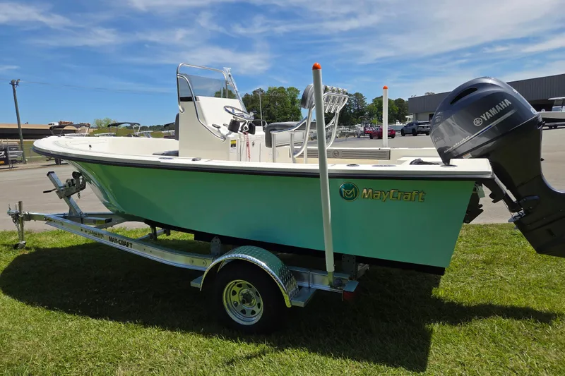 Slide: The Image of 2026 May-Craft 182 Center Console boat on trailer, featuring Yamaha outboard motor. - 5