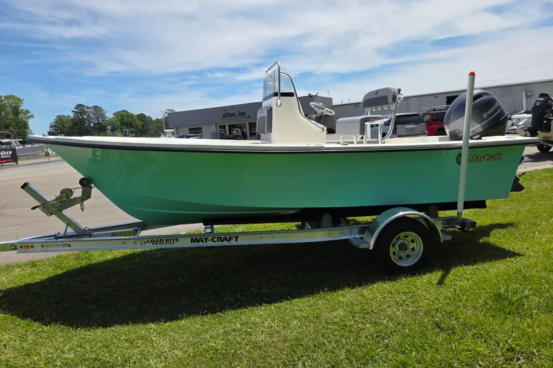 Slide: The Image of 2026 May-Craft 182 Center Console boat on trailer, displayed outdoors on grass. - 6