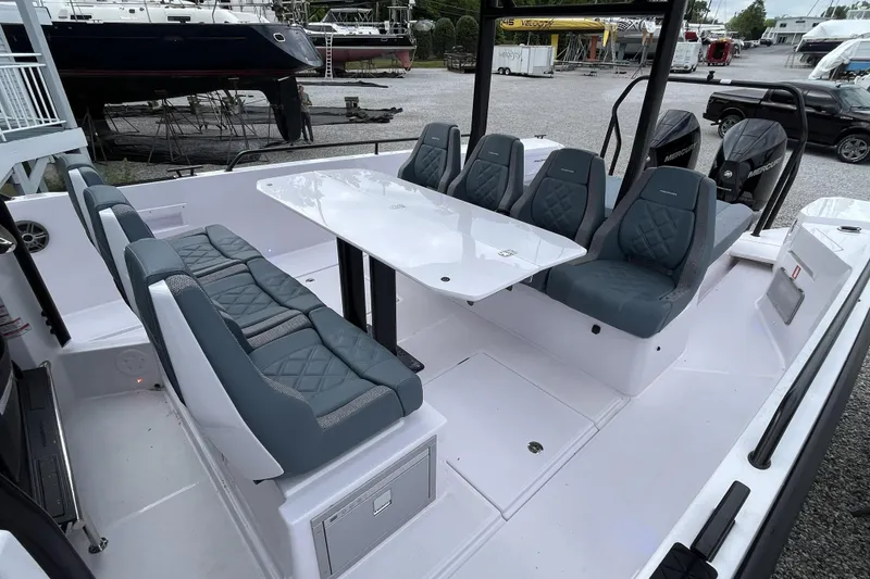 Slide: The Image of 2025 Axopar 37 Sun-Top boat interior with sleek seating and modern design. - 20