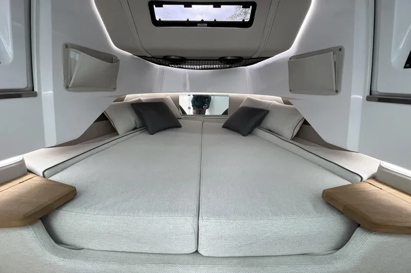 Slide: The Image of Luxurious interior cabin of 2025 Axopar 37 Sun-Top with comfortable bedding and modern design. - 30