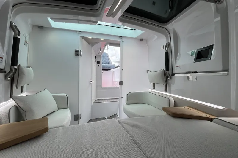 Slide: The Image of Interior of 2025 Axopar 37 Sun-Top boat, featuring modern seating and sleek design. - 31