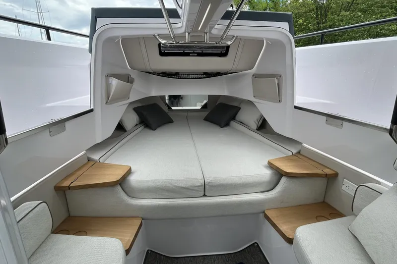 Slide: The Image of Luxurious interior of 2025 Axopar 37 Sun-Top boat with spacious bed and modern design. - 32