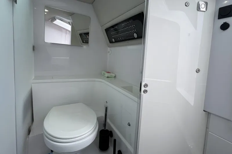 Slide: The Image of Modern bathroom interior of 2025 Axopar 37 Sun-Top boat, featuring sleek design and amenities. - 35