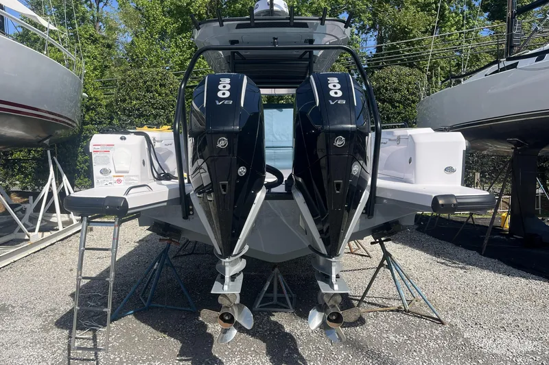 Slide: The Image of 2025 Axopar 37 Sun-Top with dual 300 V8 engines, displayed outdoors. - 4