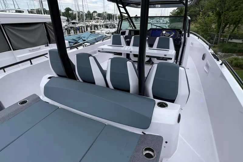 Slide: The Image of 2025 Axopar 37 Sun-Top boat interior with sleek seating and modern design. - 49