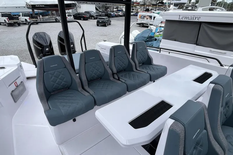 Slide: The Image of 2025 Axopar 37 Sun-Top boat interior with stylish seating and modern design. - 51