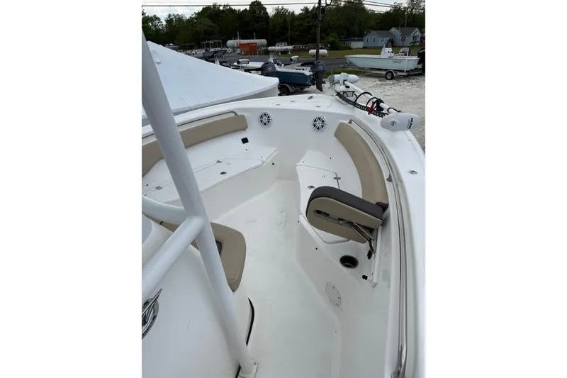 Slide: The Image of 2023 Tidewater 220 CC Adventure boat interior with seating and speakers. - 5