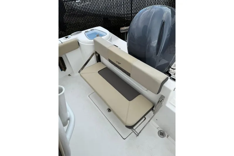 Slide: The Image of 2023 Tidewater 220 CC Adventure boat with foldable seating and motor detail. - 8