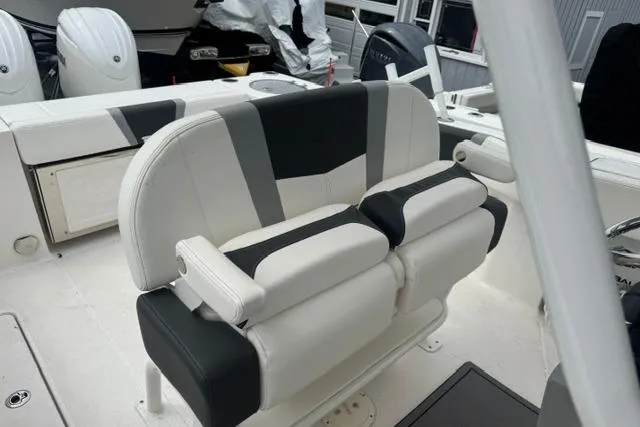 Slide: The Image of 2025 Robalo R250 Center Console boat interior with stylish seating and modern design. - 7
