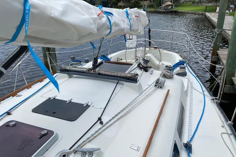 Slide: The Image of 1981 C&C 40 sailboat docked, featuring deck and rigging details. - 12