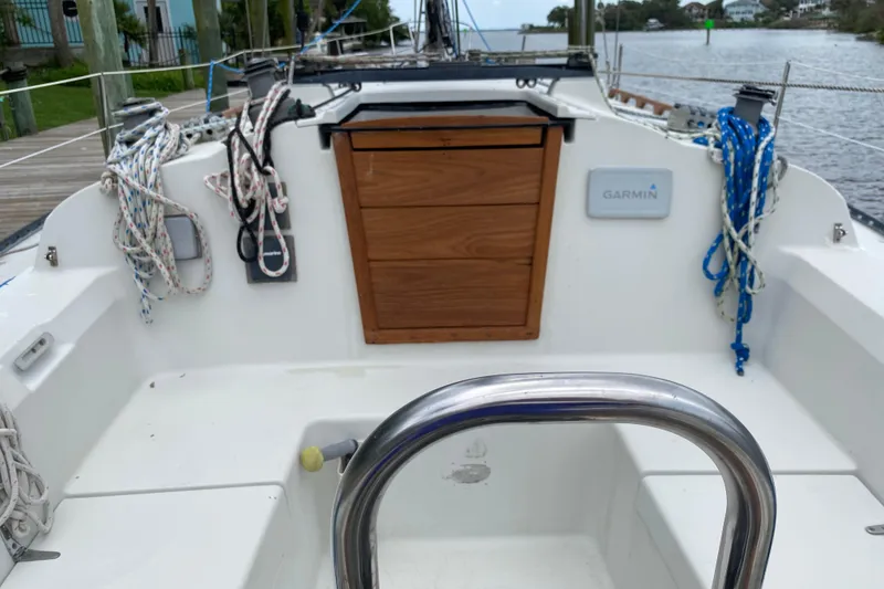 Slide: The Image of Cockpit of a 1981 C&C 40 sailboat with ropes and Garmin equipment. - 15