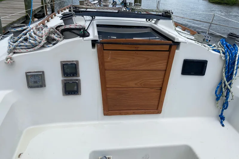 Slide: The Image of Cockpit of 1981 C&C 40 sailboat with instruments and ropes. - 17