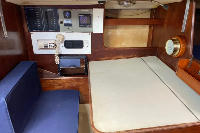 Slide: The Image of 1981 C&C 40 yacht interior with navigation equipment and seating area. - 21