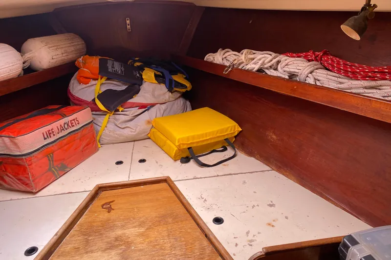 Slide: The Image of Interior of 1981 C&C 40 sailboat with life jackets and ropes stored neatly. - 26