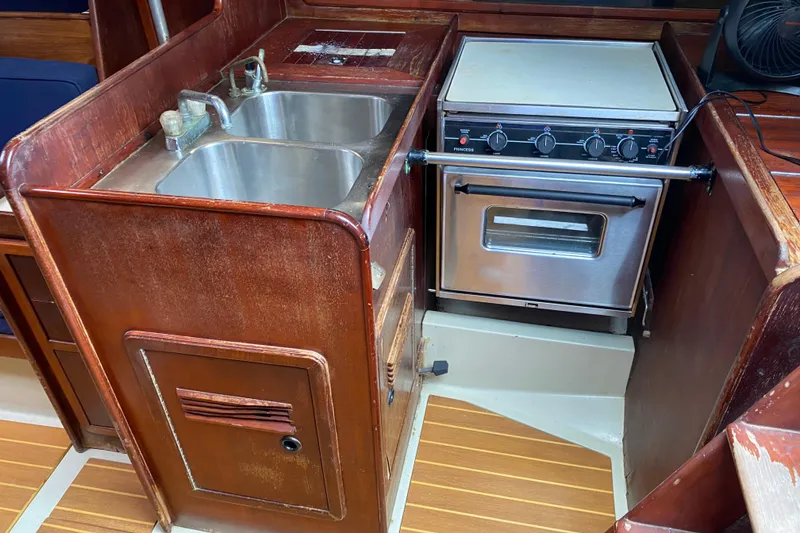 Slide: The Image of 1981 C&C 40 yacht kitchen with stainless steel sink and compact stove. - 29