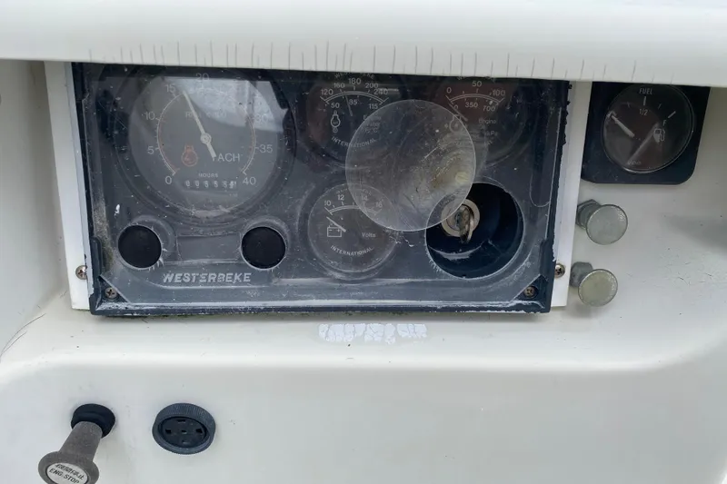 Slide: The Image of Dashboard of a 1981 C&C 40 sailboat with Westerbeke engine gauges. - 33