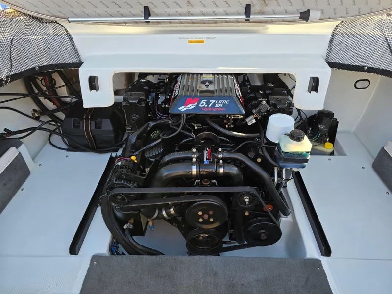 Slide: The Image of Engine compartment of a 2000 Mariah 20 Shabah boat with a 5.7L engine. - 16