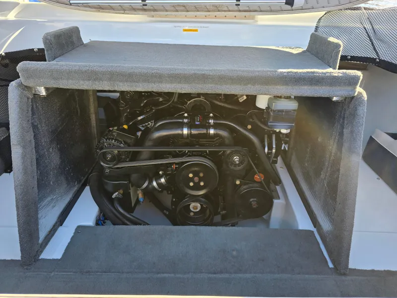 Slide: The Image of Engine compartment of a 2000 Mariah 20 Shabah boat, showcasing mechanical components. - 18