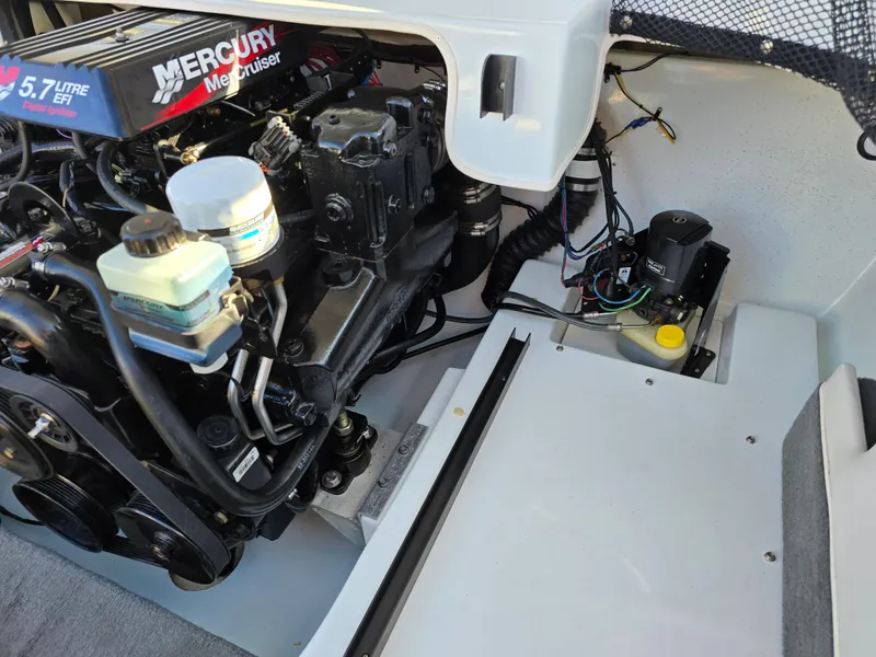 Slide: The Image of Engine compartment of a 2000 Mariah 20 Shabah with Mercury 5.7L EFI engine. - 19