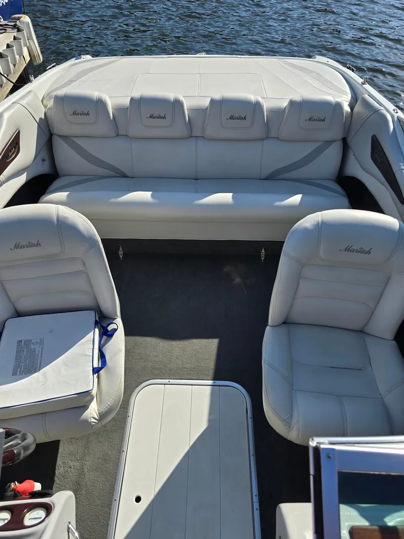 Slide: The Image of Interior of a 2000 Mariah 20 Shabah boat with white leather seating. - 7
