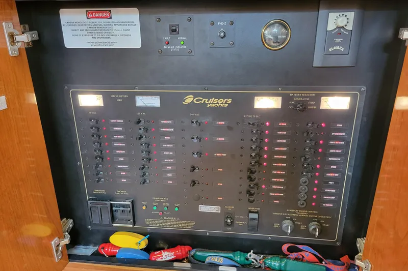 Slide: The Image of Electrical control panel of a 2004 Cruisers Yachts 400 Express boat. - 19