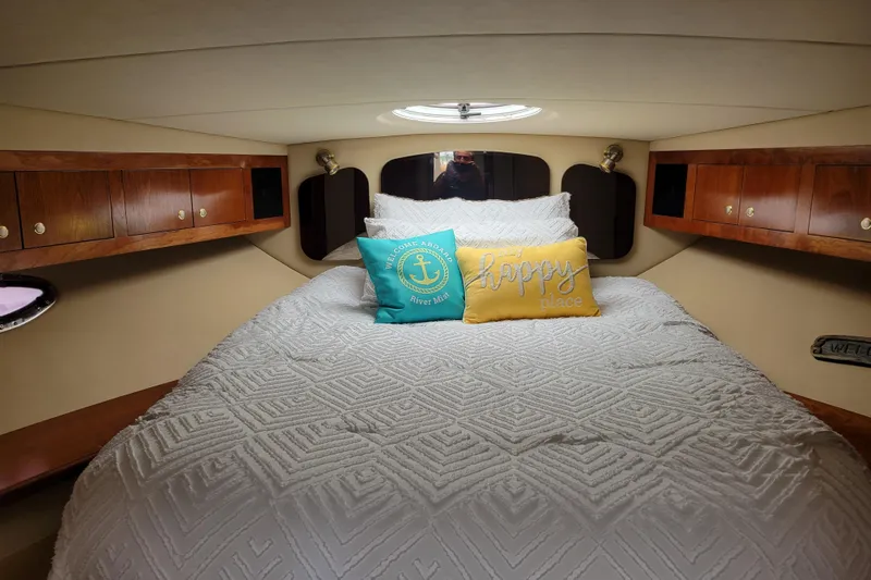 Slide: The Image of Luxurious cabin interior of 2004 Cruisers Yachts 400 Express with cozy bedding. - 3