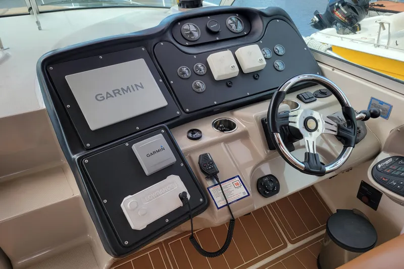 Slide: The Image of Helm of 2004 Cruisers Yachts 400 Express with Garmin navigation system. - 30