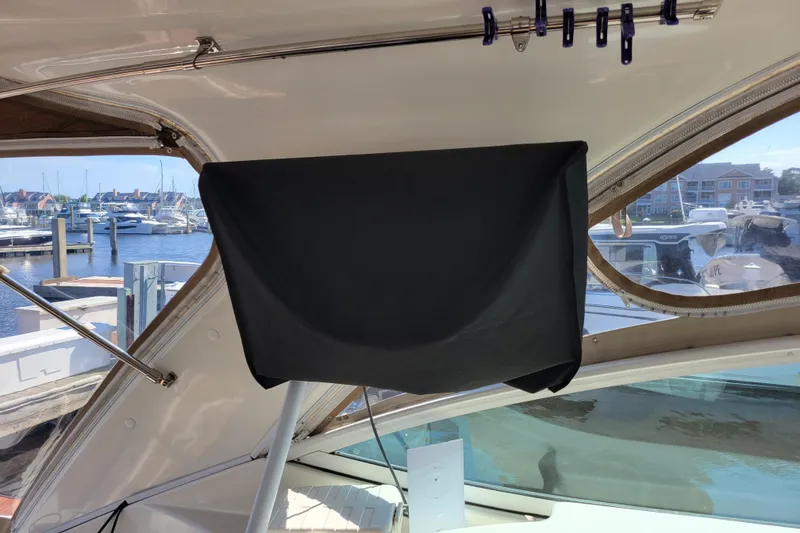 Slide: The Image of 2004 Cruisers Yachts 400 Express interior with marina view through window. - 42