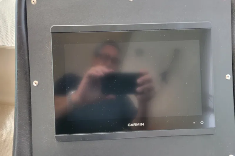 Slide: The Image of Garmin display on 2004 Cruisers Yachts 400 Express dashboard. - 46