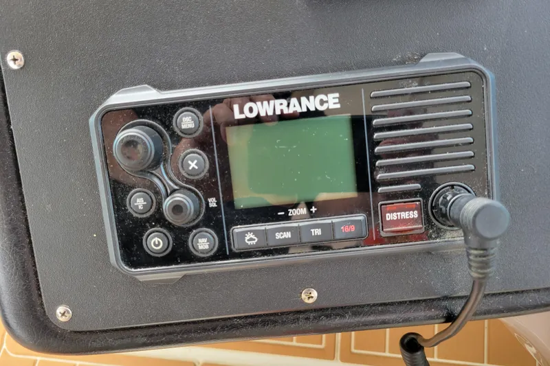 Slide: The Image of Lowrance marine radio on 2004 Cruisers Yachts 400 Express dashboard. - 47
