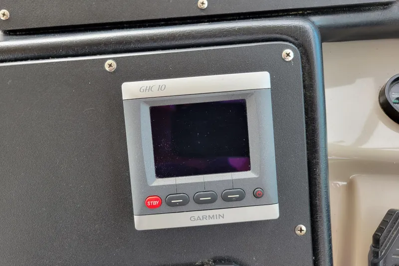 Slide: The Image of Garmin GHC 10 marine display on 2004 Cruisers Yachts 400 Express dashboard. - 48