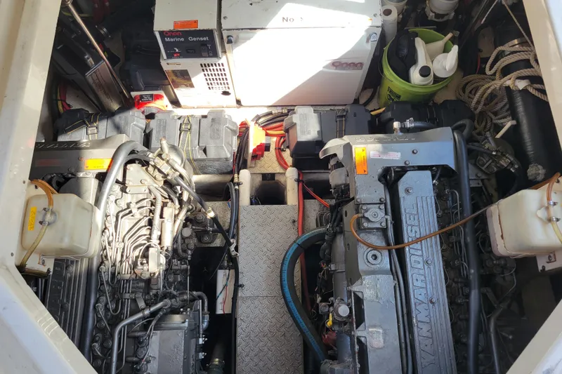 Slide: The Image of Engine room of 2004 Cruisers Yachts 400 Express with Yanmar diesel engines and Onan marine generator. - 52