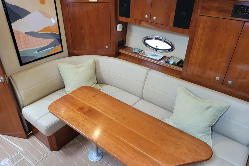Slide: The Image of Luxurious 2004 Cruisers Yachts 400 Express interior with elegant wood and leather seating. - 8