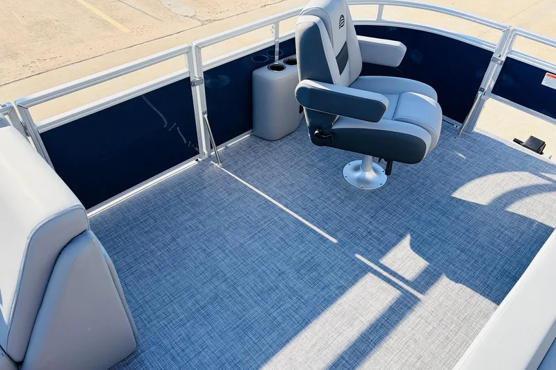 Slide: The Image of 2026 Sun Tracker SportFish 20 DLX boat interior with gray seating and flooring. - 12