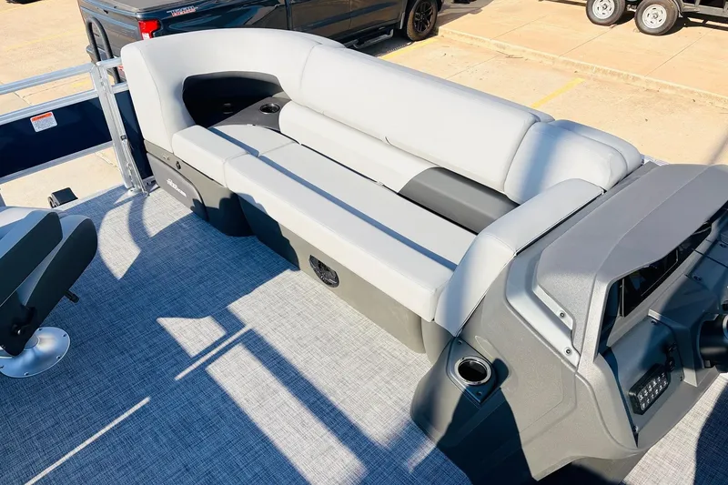 Slide: The Image of 2026 Sun Tracker SportFish 20 DLX boat interior with gray seating and console. - 16