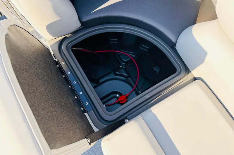 Slide: The Image of Storage compartment in 2026 Sun Tracker SportFish 20 DLX boat, featuring seating and wiring. - 20