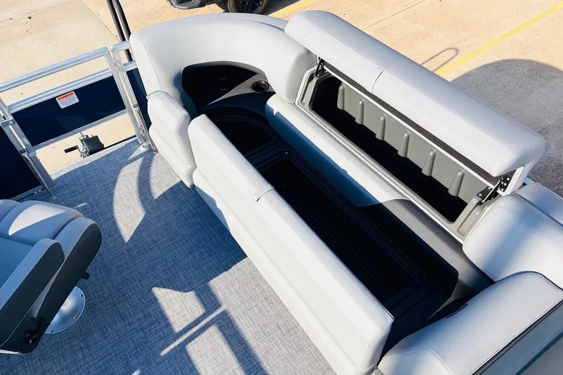 Slide: The Image of 2026 Sun Tracker SportFish 20 DLX boat interior with open storage compartments. - 22