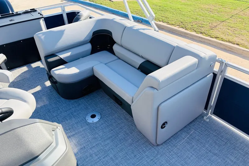 Slide: The Image of 2026 Sun Tracker SportFish 20 DLX pontoon boat with comfortable seating and modern design. - 23