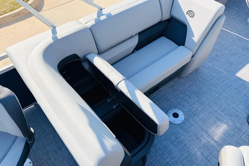 Slide: The Image of 2026 Sun Tracker SportFish 20 DLX boat interior with open storage compartments. - 28