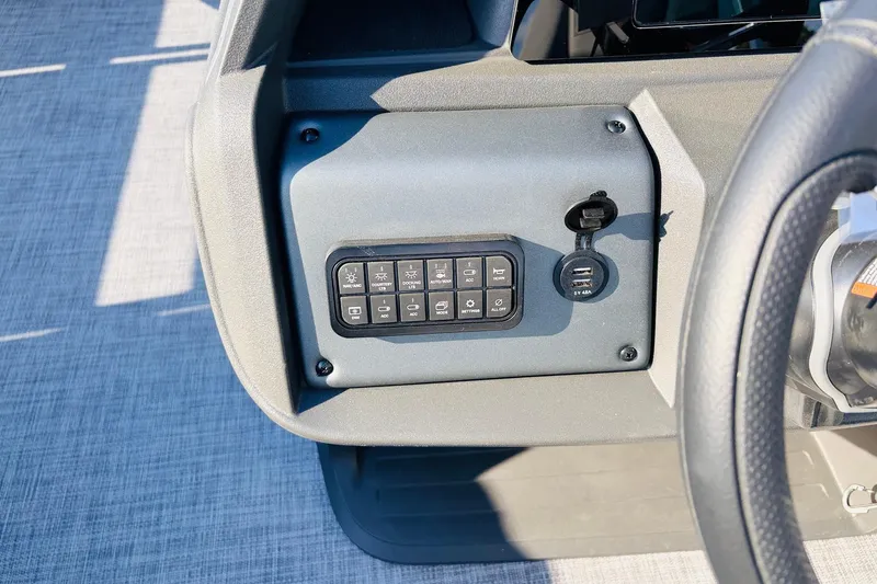Slide: The Image of Control panel of 2026 Sun Tracker SportFish 20 DLX with USB ports and switches. - 33