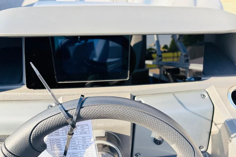 Slide: The Image of Steering wheel and dashboard of 2026 Sun Tracker SportFish 20 DLX boat. - 34