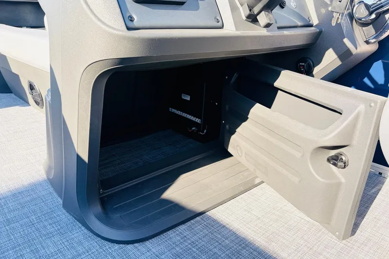 Slide: The Image of Open storage compartment in 2026 Sun Tracker SportFish 20 DLX boat. - 36