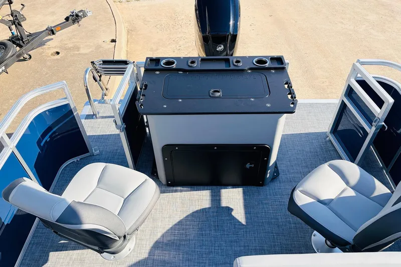 Slide: The Image of 2026 Sun Tracker SportFish 20 DLX boat interior with seating and control panel. - 38